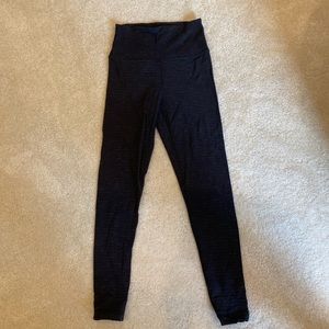 Worn grey TNA Aritzia leggings in a size XS